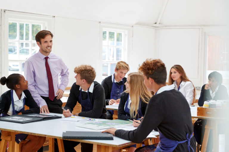 Teenage,Students,Listening,To,Teacher,In,Art,Class